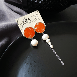 orange mismatched earrings, circle enamel studs with natural pearls