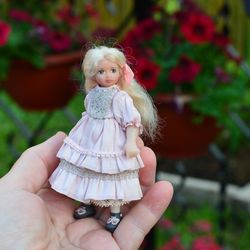Miniature doll child in 12th scales