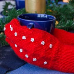 Hand knit decorated snowflake red women mittens. Handmade.
