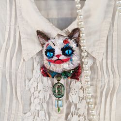 Embroidered brooch of the Joker Cat with a tie made of natural and vintage beads.