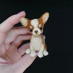 Chihuahua. Miniature crocheted dog. A puppy to order. Cute little pet. Amigurumi is a dog. A keepsake. Dog souvenir