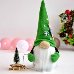 Scandinavian Christmas gnome with a Christmas tree