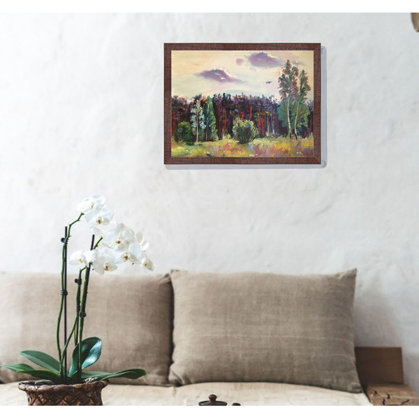 landscape painting over a sofa