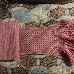 knitted pink scarf with fringe