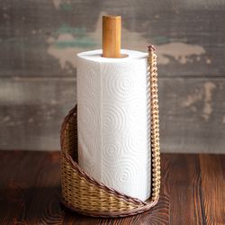 standing paper towel organizer. handmade roll dispenser for kitchen countertop. wicker basket for storing paper towels.