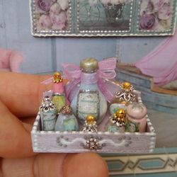 A set of bottles in a box. Dollhouse accessories.1:12 scale.