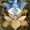 20201108-Blue Stained glass Hamsa hand suncatcher with brown and beige lotus flower hanging in front of a green Thuja tree.jpg