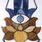 20201108-Stained glass blue hand with eye Hamsa suncatcher with brown and beige lotus flower on a white background.jpg