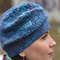 woman-in-blue-hat-close