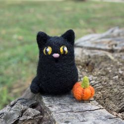 Needle felted black cat with a tiny pumpkin Halloween decor