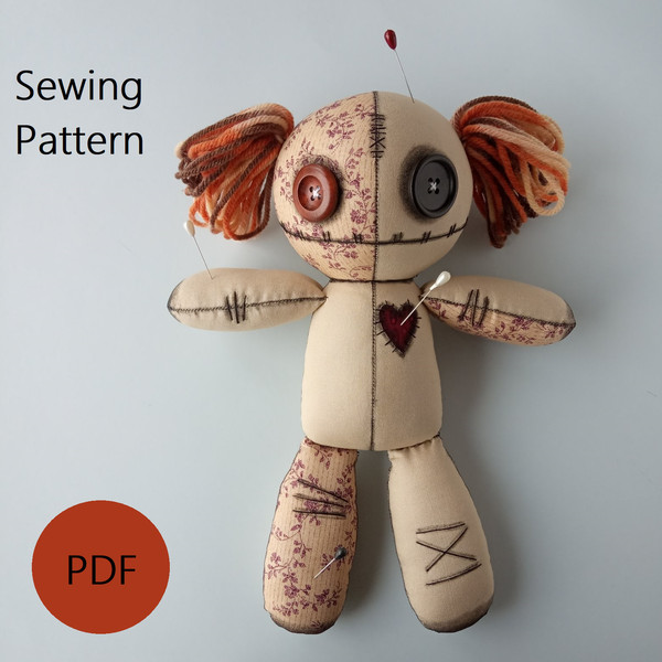 Stuffed-voodoo-doll-with-pins-and-yarn-hair-1
