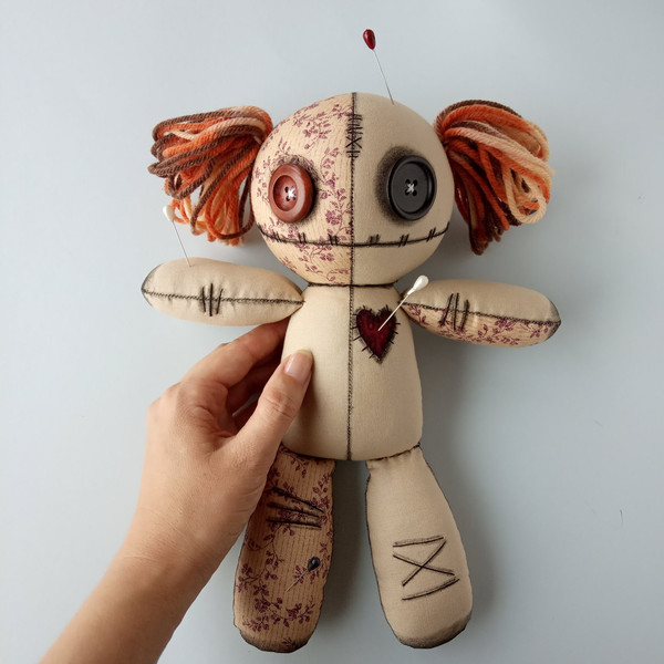 Stuffed-voodoo-doll-with-pins-and-yarn-hair-2