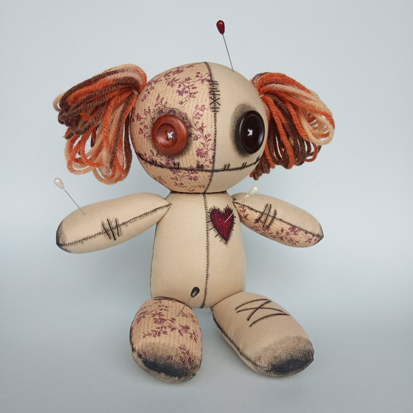 Stuffed-voodoo-doll-with-pins-and-yarn-hair-3