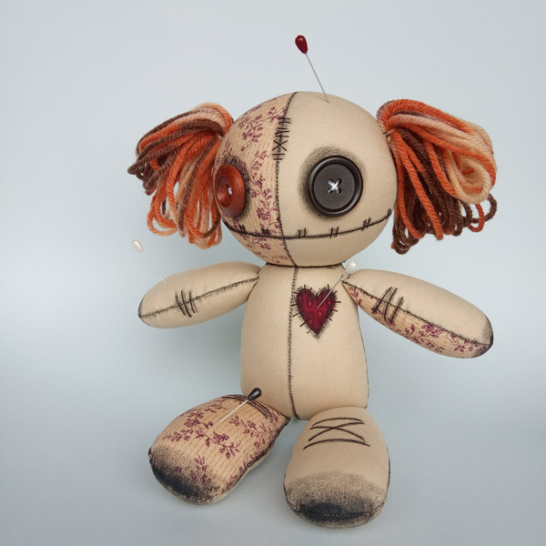 Stuffed-voodoo-doll-with-pins-and-yarn-hair-4