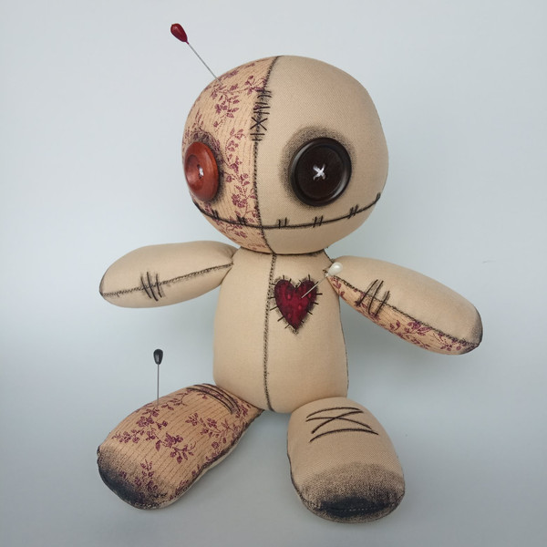 Stuffed-voodoo-doll-with-pins-4