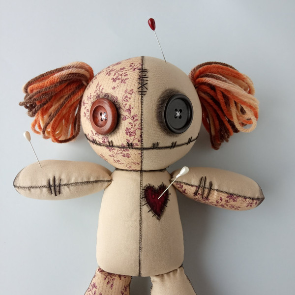 Stuffed-voodoo-doll-with-pins-and-yarn-hair-5