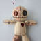 Stuffed-voodoo-doll-with-pins-5