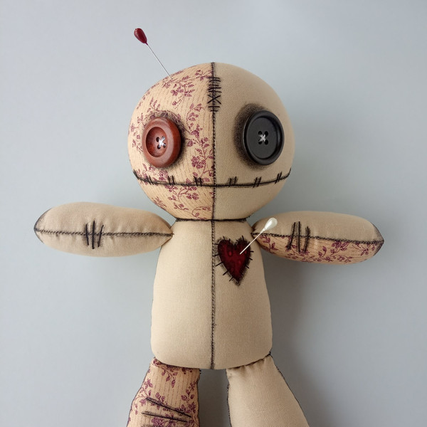 Stuffed-voodoo-doll-with-pins-5