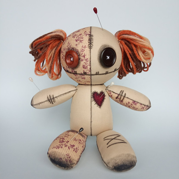 Stuffed-voodoo-doll-with-pins-and-yarn-hair-6
