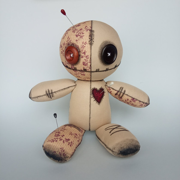 Stuffed-voodoo-doll-with-pins-6