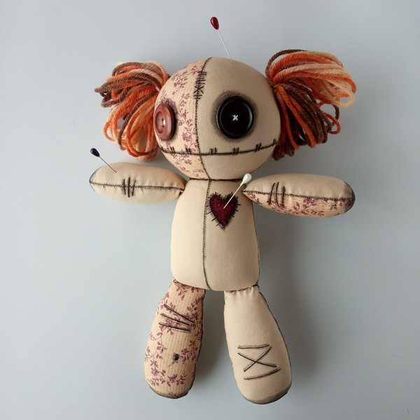 Stuffed-voodoo-doll-with-pins-and-yarn-hair-8