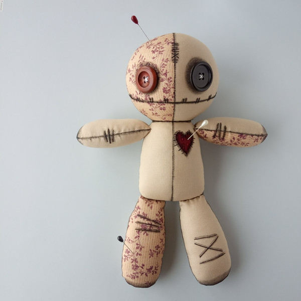 Stuffed-voodoo-doll-with-pins-7