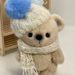 Interior bear with cap and scarf