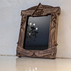 Wall mirror with black glass in carving wooden frame