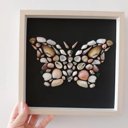 Gothic butterfly made of shells and sea glass. Butterfly on black Halloween in a frame. Sea glass art. Shell wall art.