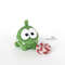 Crochet Om Nom from the cartoon Cut the Rope with candy