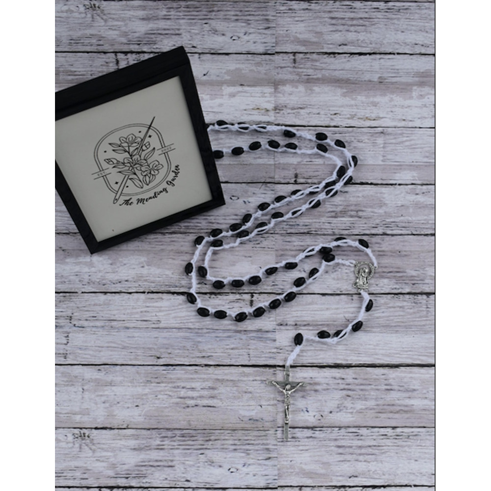 Rosary Laying.png