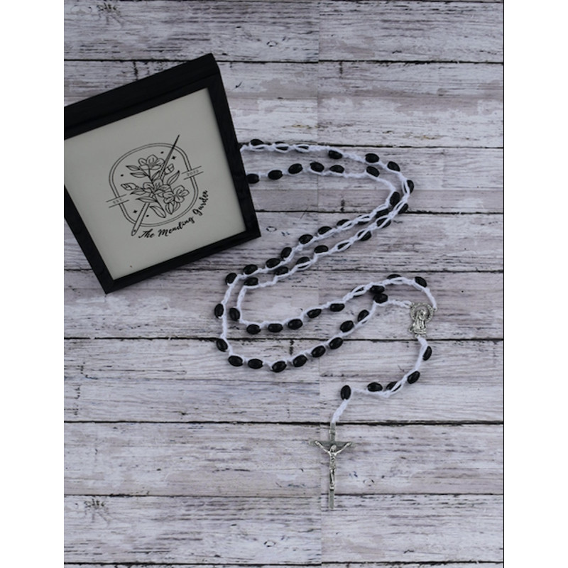 Rosary Laying.png