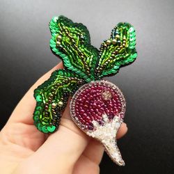 An unusual radish brooch is an unusual gift