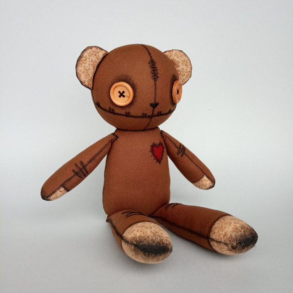 Creepy-cute-brown-stuffed-bear-with-button-eyes-7