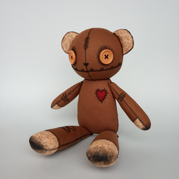 Creepy-cute-brown-stuffed-bear-with-button-eyes-10