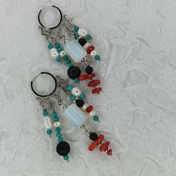 Fashionable large multi-colored earrings made of natural stones.