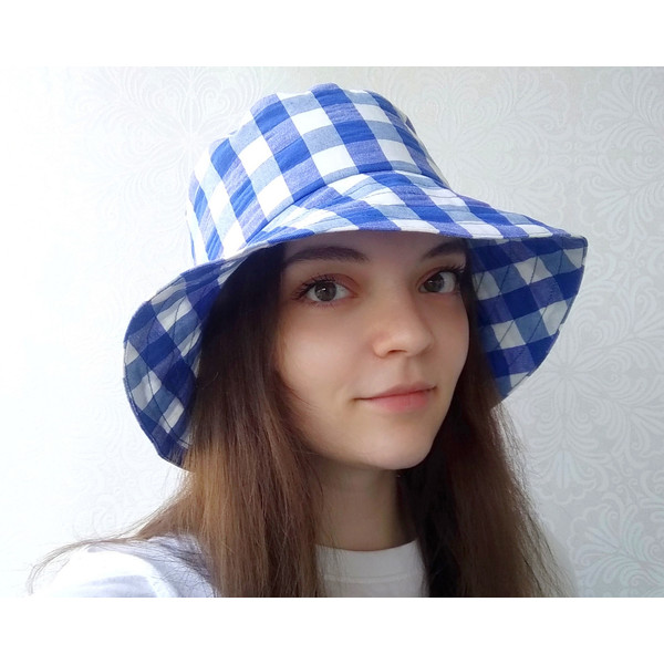 Checkered bucket hat. Cute summer hat for women. A fashion hat for traveling in checkers. Plaid blue and white sun hat.