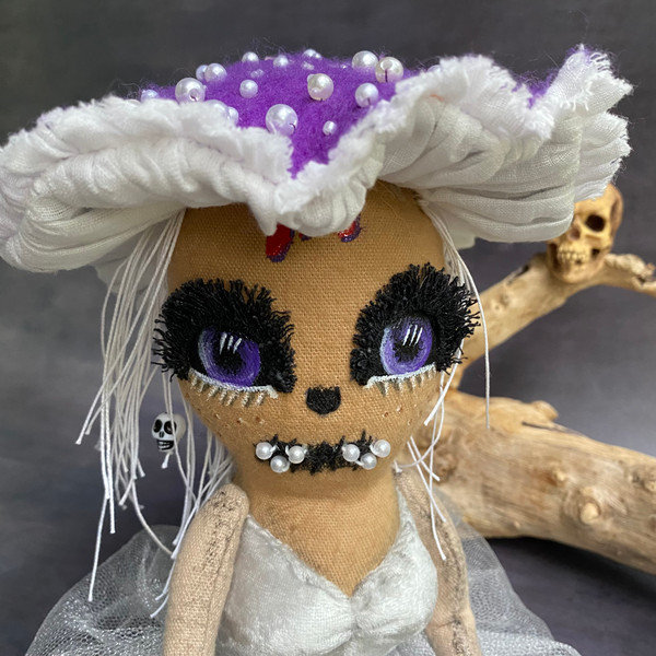 creepy mushroom doll in purple hat