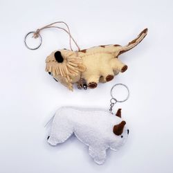 Keychains in the shape of a white buffalo and a mythical creature, funny gift