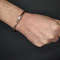 copper bracelet on man's wrist.jpeg