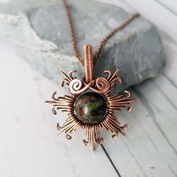 sun necklace with dragons blood jasper bead. wire wrapped copper pendant with jasper bead.