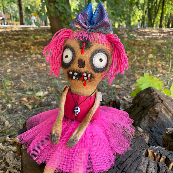 Creepy doll in pink dress