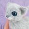 Realistic kitten with blue eyes.jpeg