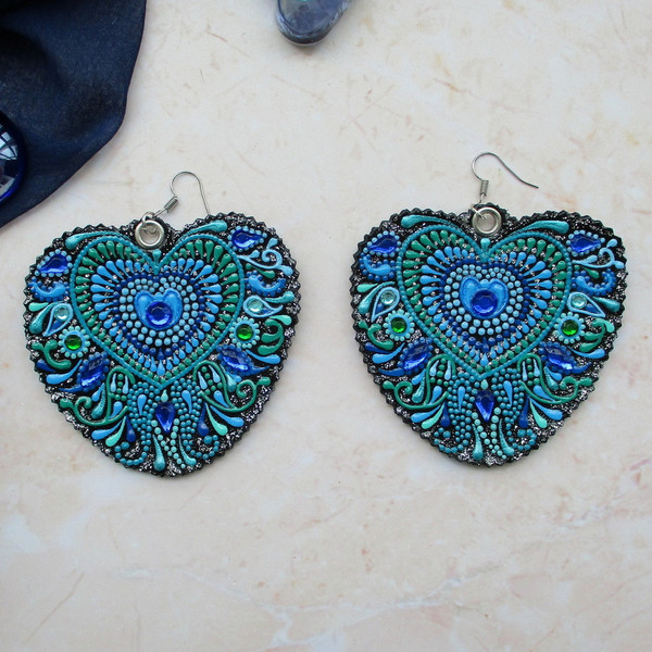 leather-earrings-peacock-feather.JPG