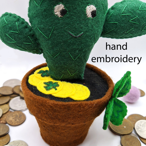 Funny cactus with hand-embroidered eyes and thorns.jpg