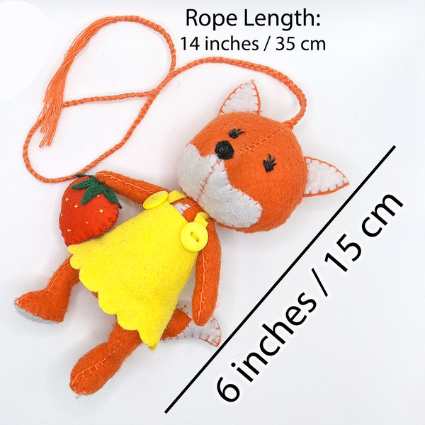 Red fox made of felt with strawberry.jpg
