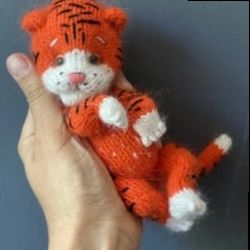 Knitted toy big orange tiger