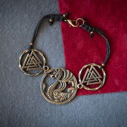 Viking bracelet with Dragon and Valknut sign on cotton cord. Ethnic bangle. Scandinavian jewelry. Norse Pagan bracelet.