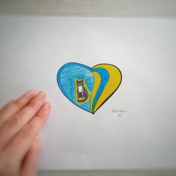 a big heart with a little kitten