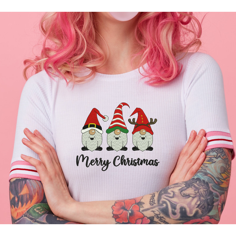 portrait-of-young-amazed-beautiful-pink-haired-lady-with-tattooed-hands-wears-in-white-t-shirt-blows-gum-ball-looking-to-the-left-in-surprise-stands-with-copy-s